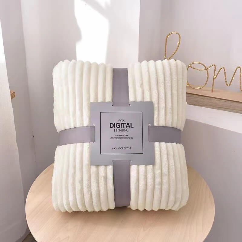 Witte fluwelen fleece deken verpakt met grijze band